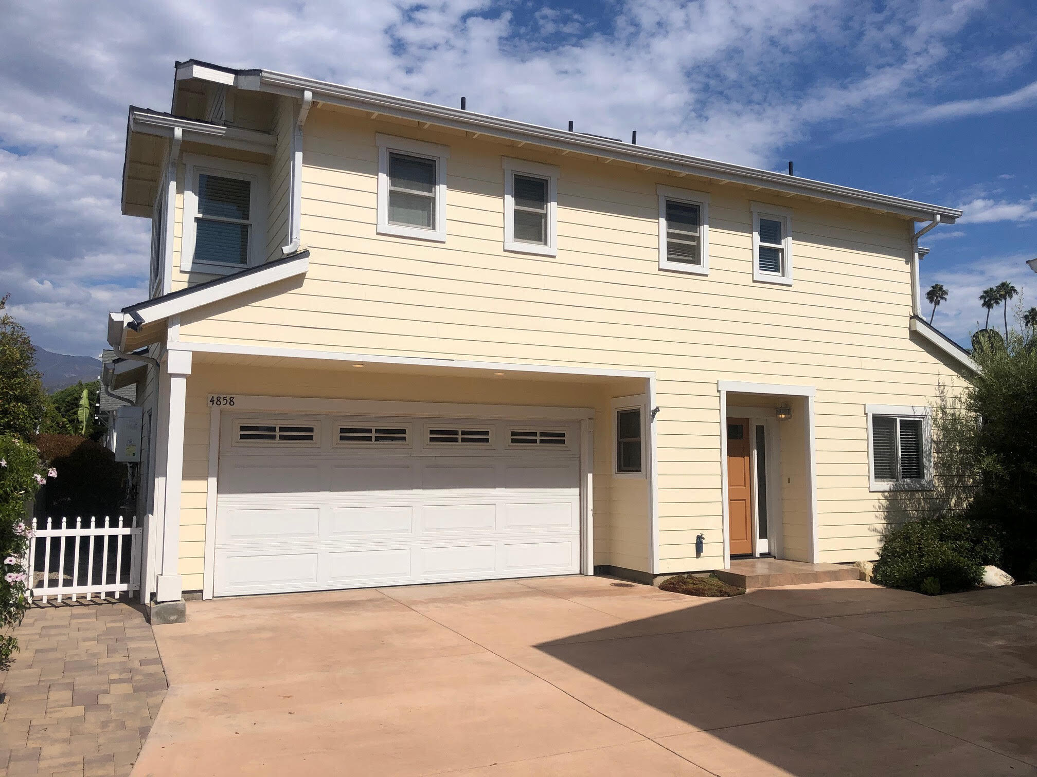 a front view of a house with a garage