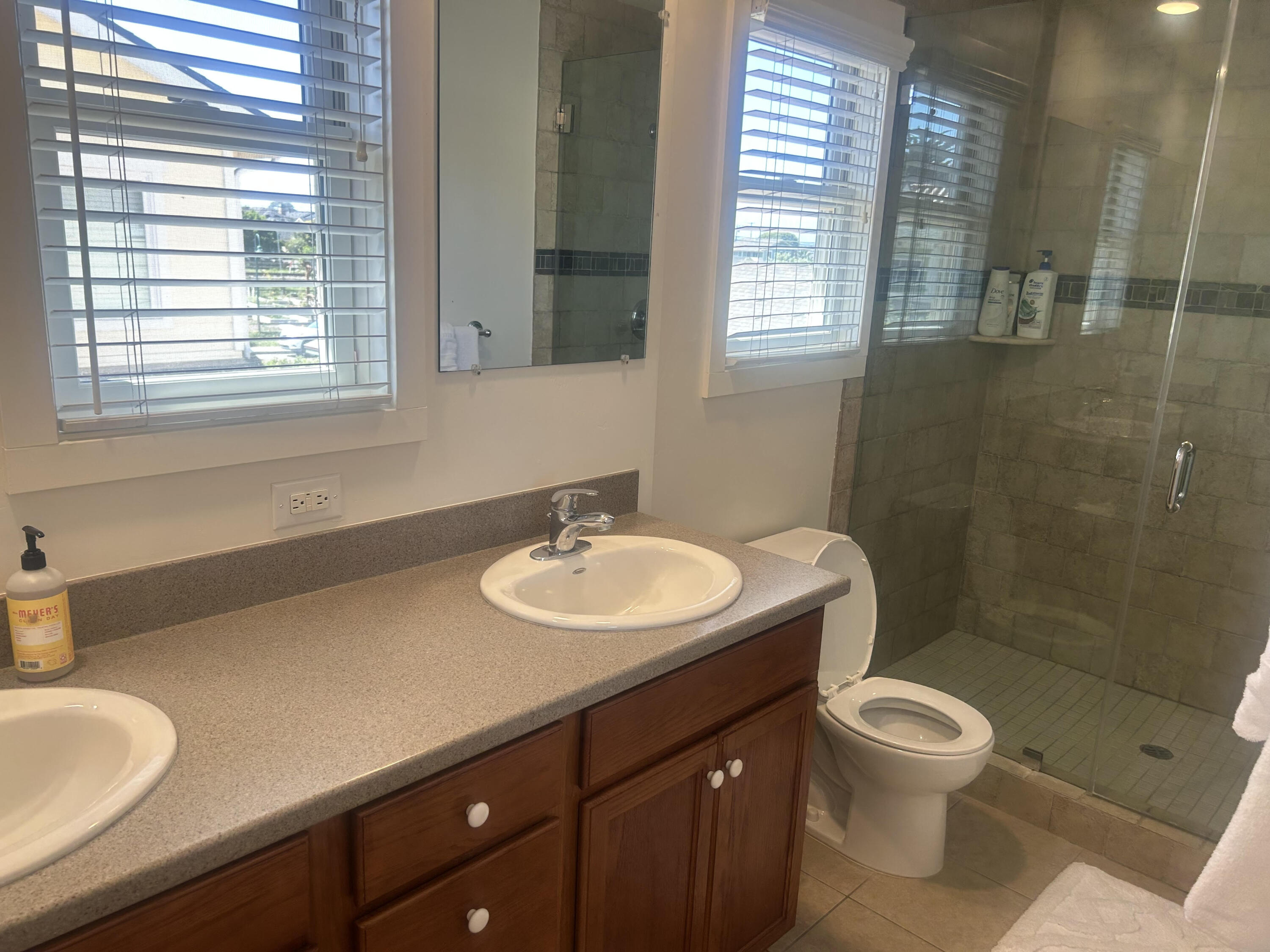 4858 5th Street Carpinteria, CA 93013 - Photo 4 of 10 a bathroom with a sink toilet a mirror and shower