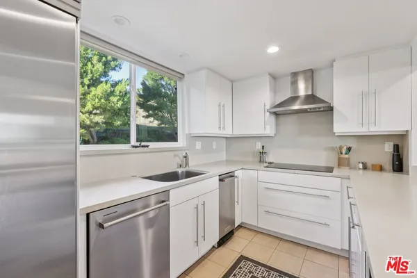a bedroom with a double bed and a window