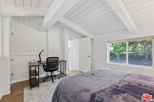 a bathroom with a granite countertop sink mirror and double