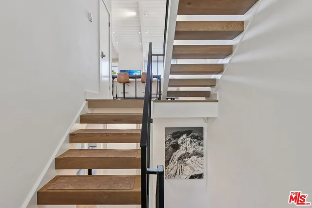 a bedroom with a large bed and a couch