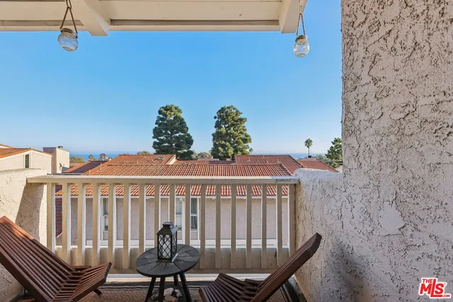 a view of balcony with furniture
