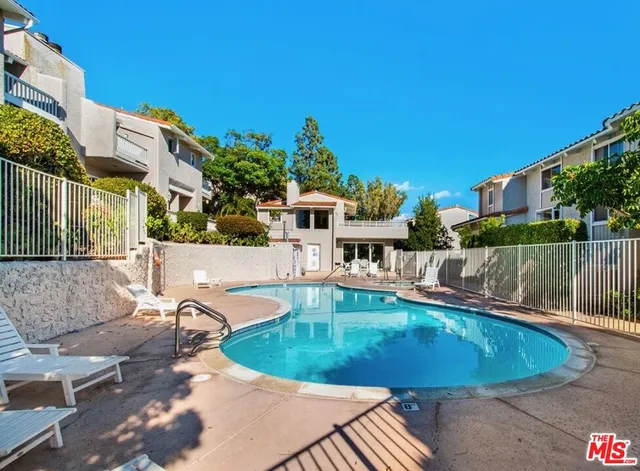 a kitchen with stainless steel appliances granite countertop a stove top oven a sink dishwasher and cabinets with wooden floor