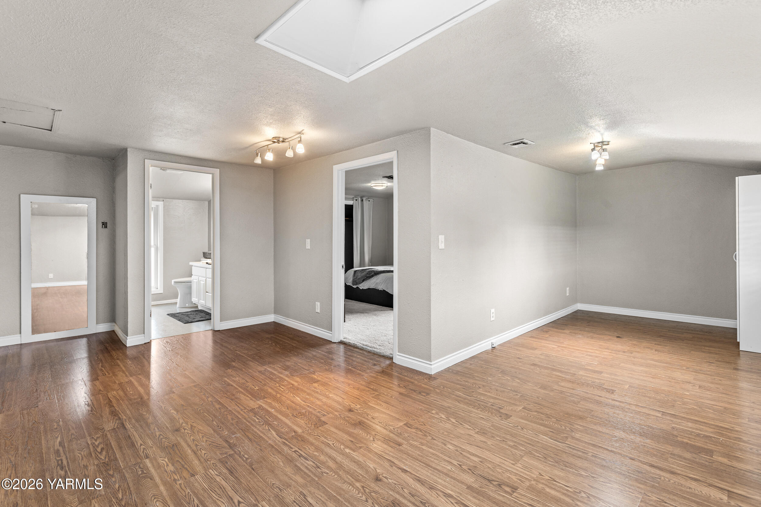 2121 Pleasant Hill Road Selah, WA 98942 - Photo 32 of 38 a view of an empty room with wooden floor