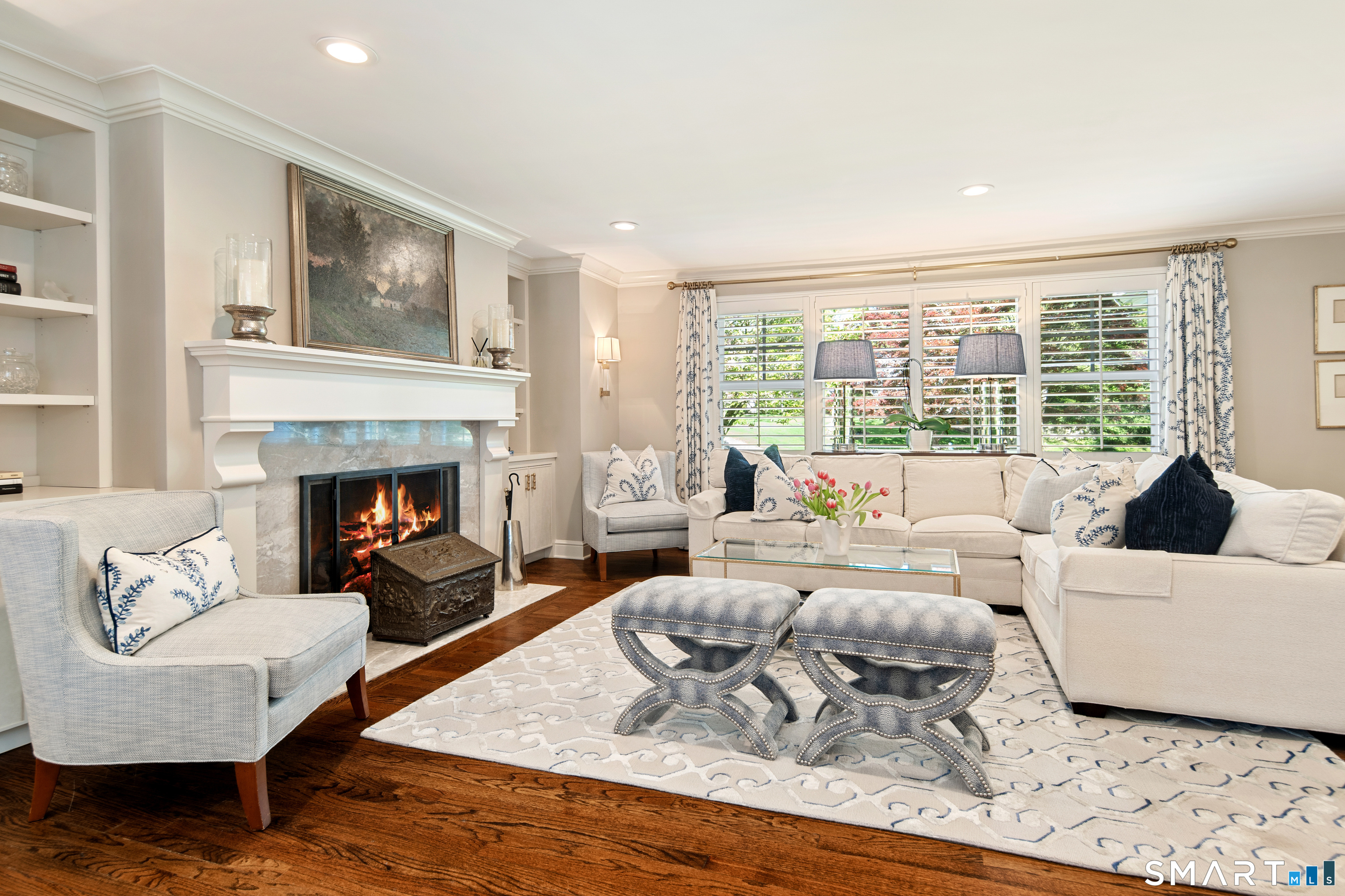 11 McLaren Road South Darien, CT 06820 - Photo 7 of 40 a living room with furniture large window and a fireplace