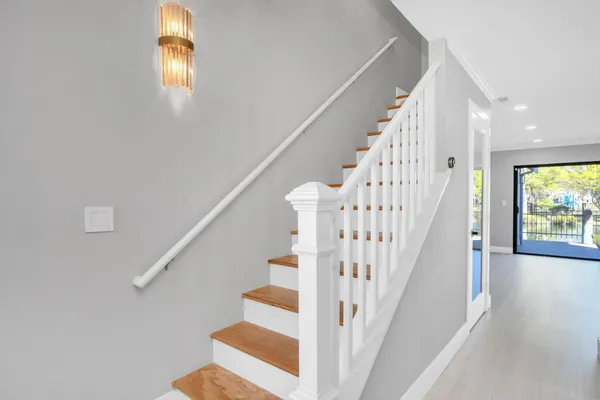 a view of hallway with wooden floor
