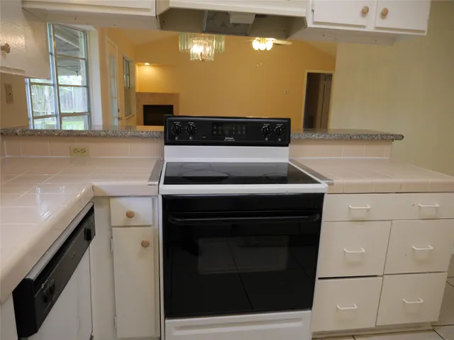 a kitchen with a stove and a sink