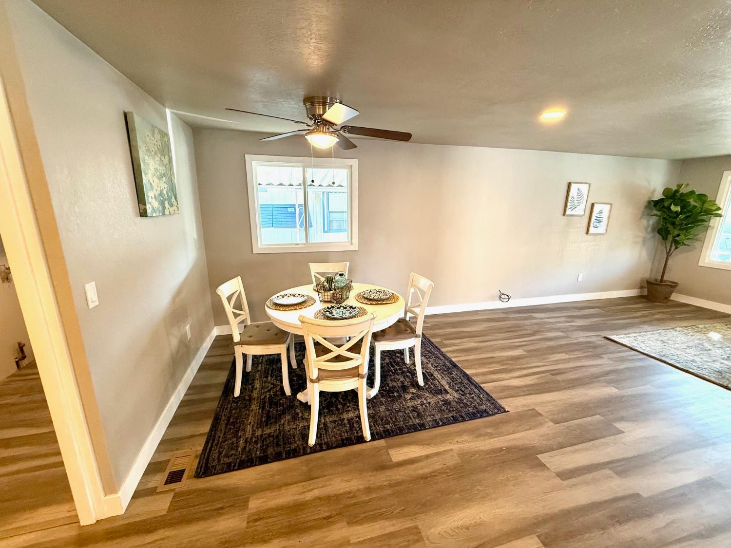 142 Sage Street Citrus Heights, CA 95621 - Photo 7 of 19 a view of a dining room with furniture and wooden floor