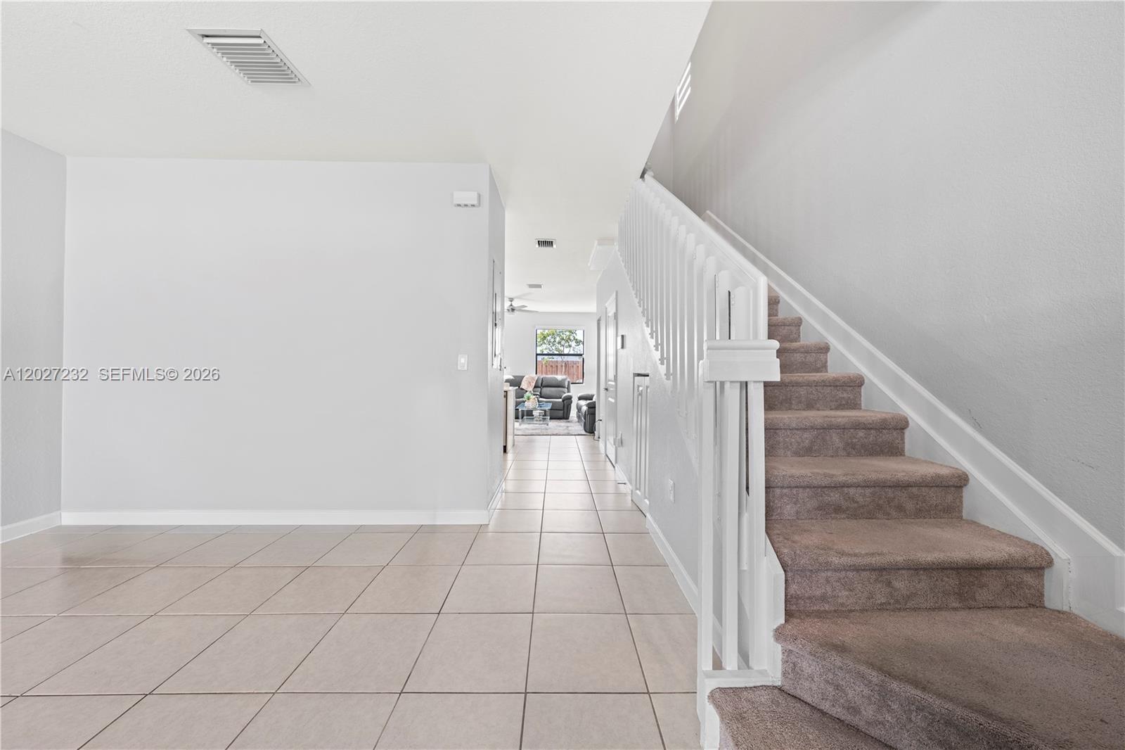23489 Southwest 127th Place Homestead, FL 33032 - Photo 12 of 24 a view of entryway and hall with wooden floor