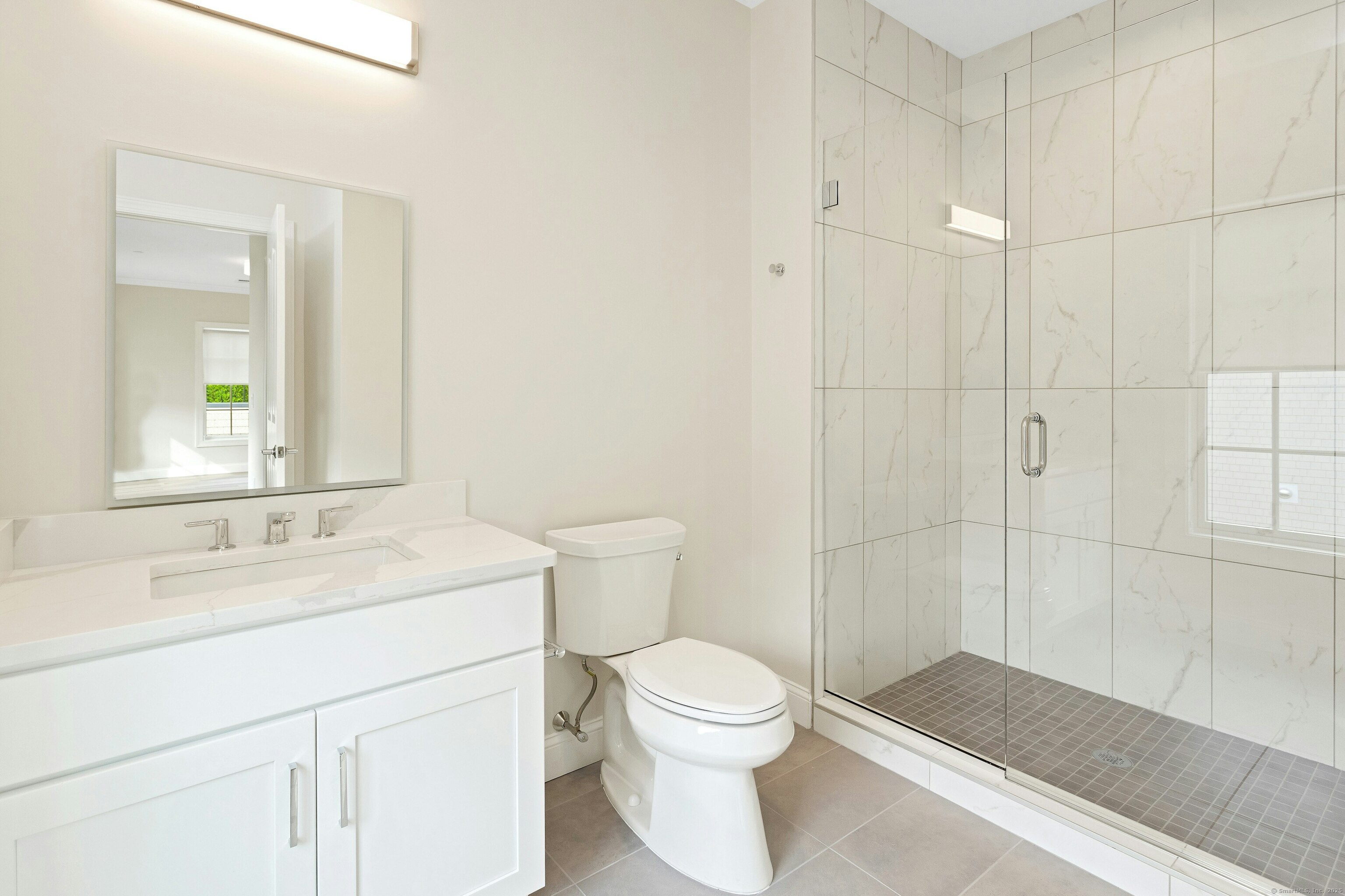 340 Heights Road, Unit 319 Darien, CT 06820 - Photo 14 of 21 a bathroom with a sink a toilet and shower