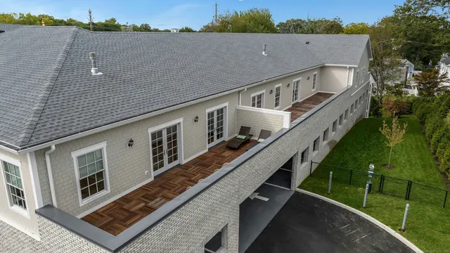 a view of a balcony with two chairs and a table