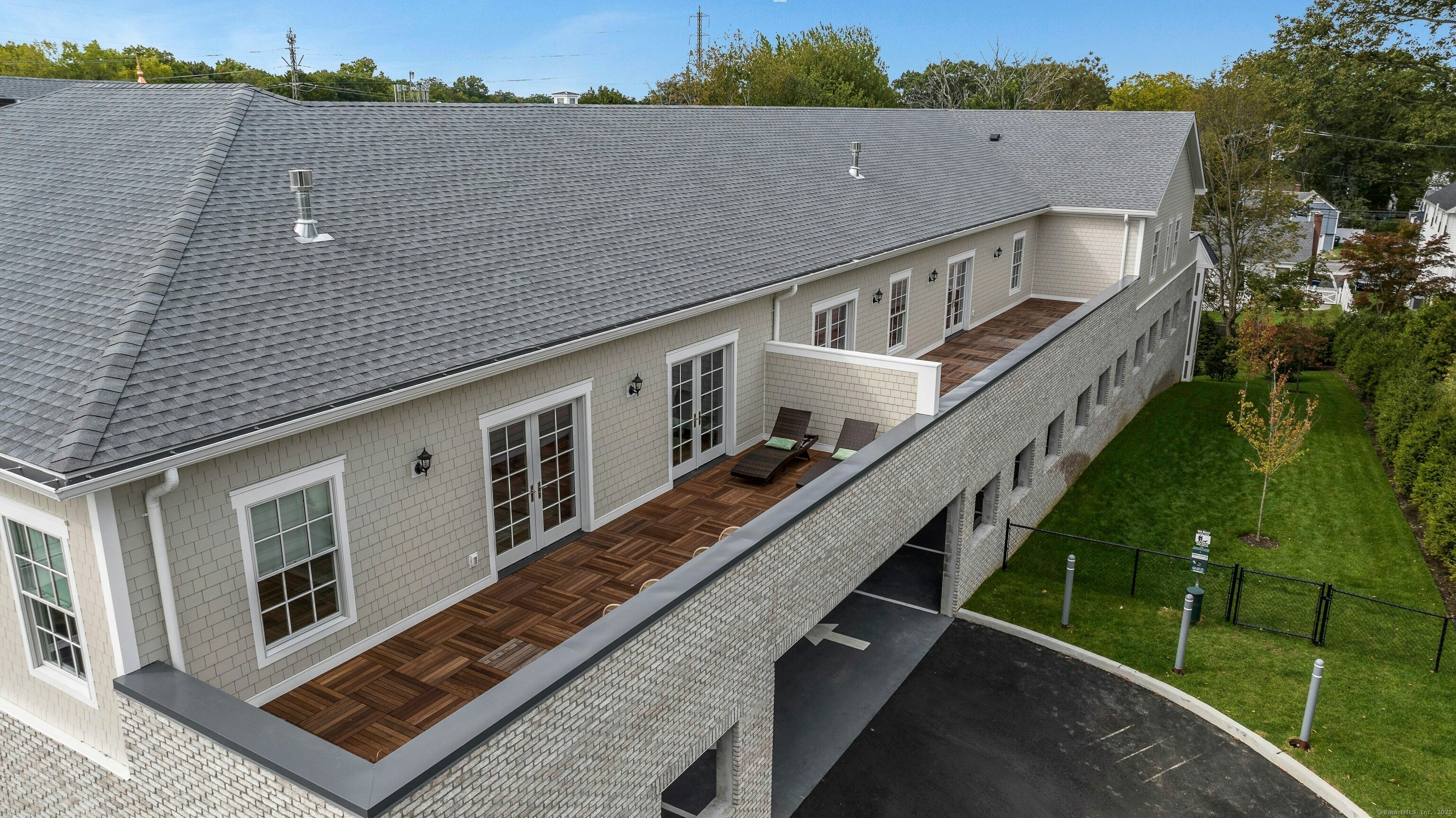 340 Heights Road, Unit 319 Darien, CT 06820 - Photo 19 of 21 a view of a balcony with two chairs and a table