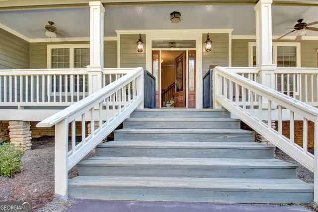 a view of staircase with white walls and a stairs