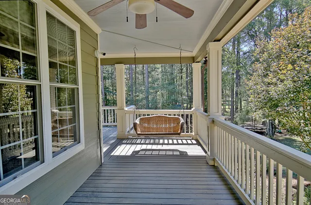 a bedroom with a bed and a wooden floor