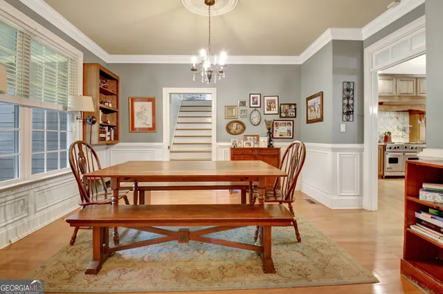 a spacious bathroom with a double vanity sink a mirror and a shower