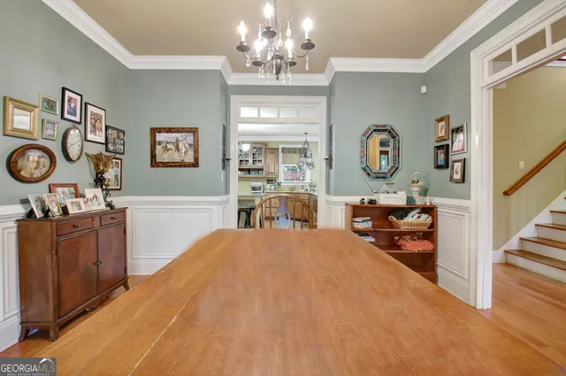 a view of livingroom with furniture and book shelf