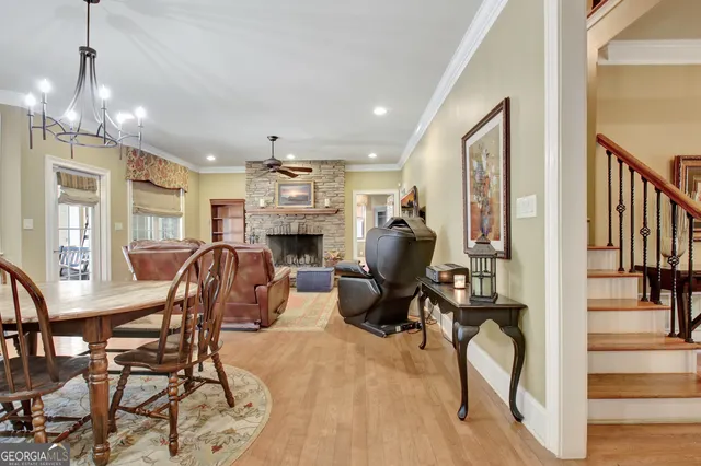 a dining room with a table and chairs