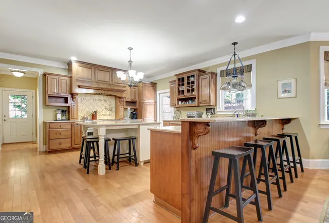 a view of a house with a yard and a bench