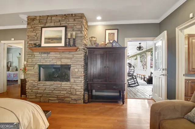 a view of backyard with a barn and large trees