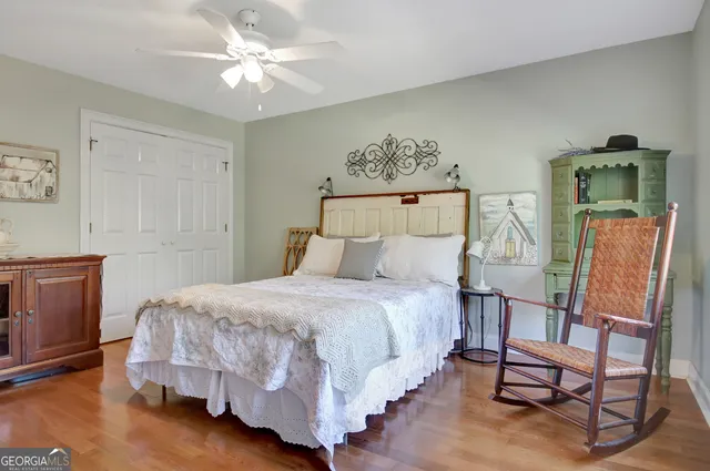 a view of a house with a yard in a park