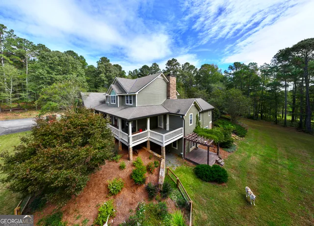 a view of a balcony with two chairs and a table