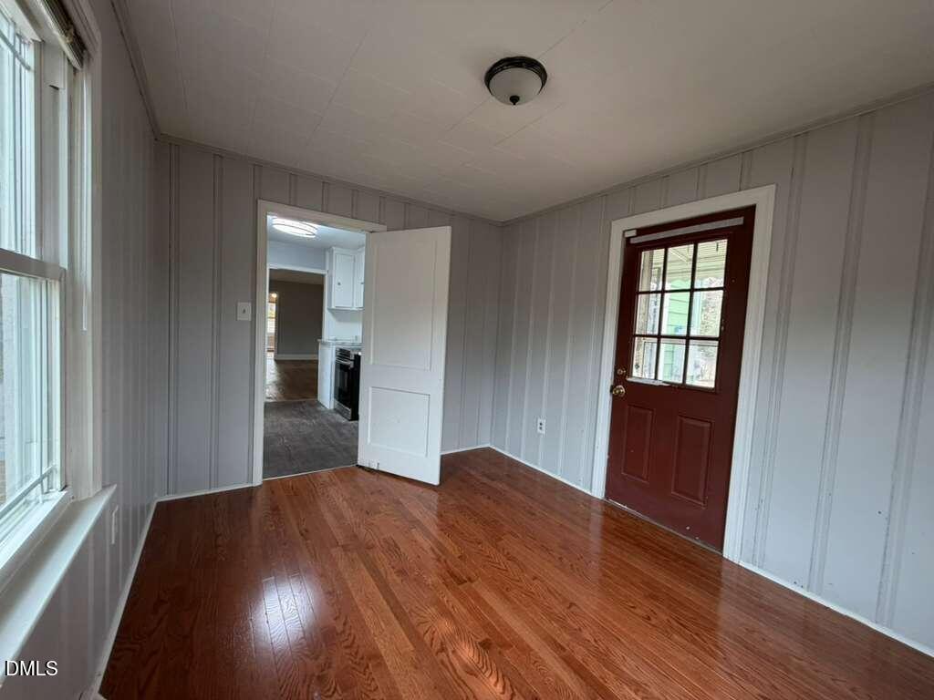 1419 Leon Street Durham, NC 27705 - Photo 14 of 23 wooden floor in an empty room with a window