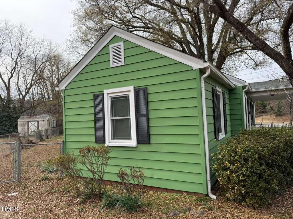 1419 Leon Street Durham, NC 27705 - Photo 15 of 23 a front view of a house with a garden