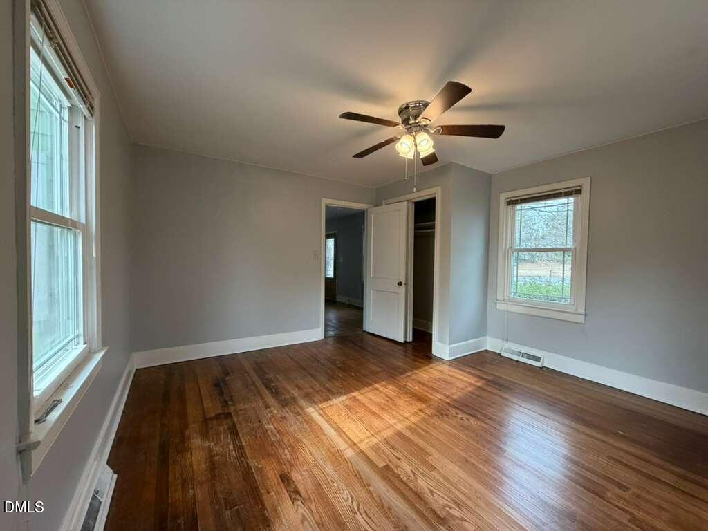 1419 Leon Street Durham, NC 27705 - Photo 18 of 23 a view of empty room with wooden floor and fan