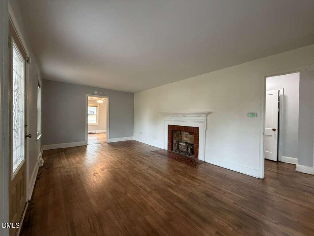 1419 Leon Street Durham, NC 27705 - Photo 22 of 23 an empty room with wooden floor and windows