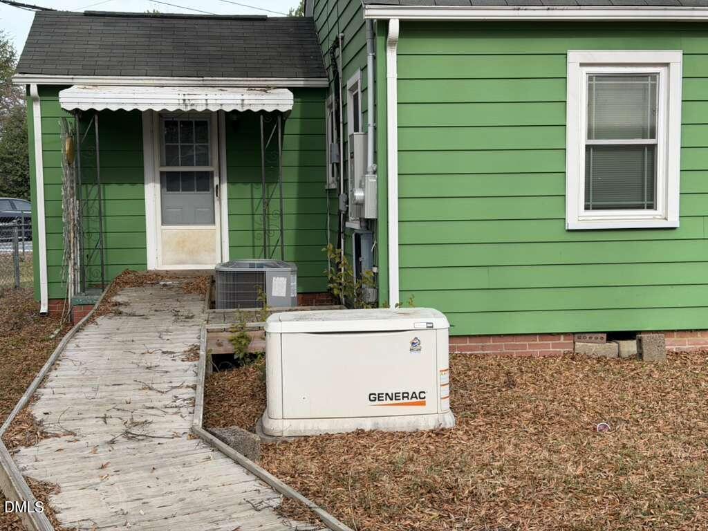 1419 Leon Street Durham, NC 27705 - Photo 5 of 23 a small white building with a white roof