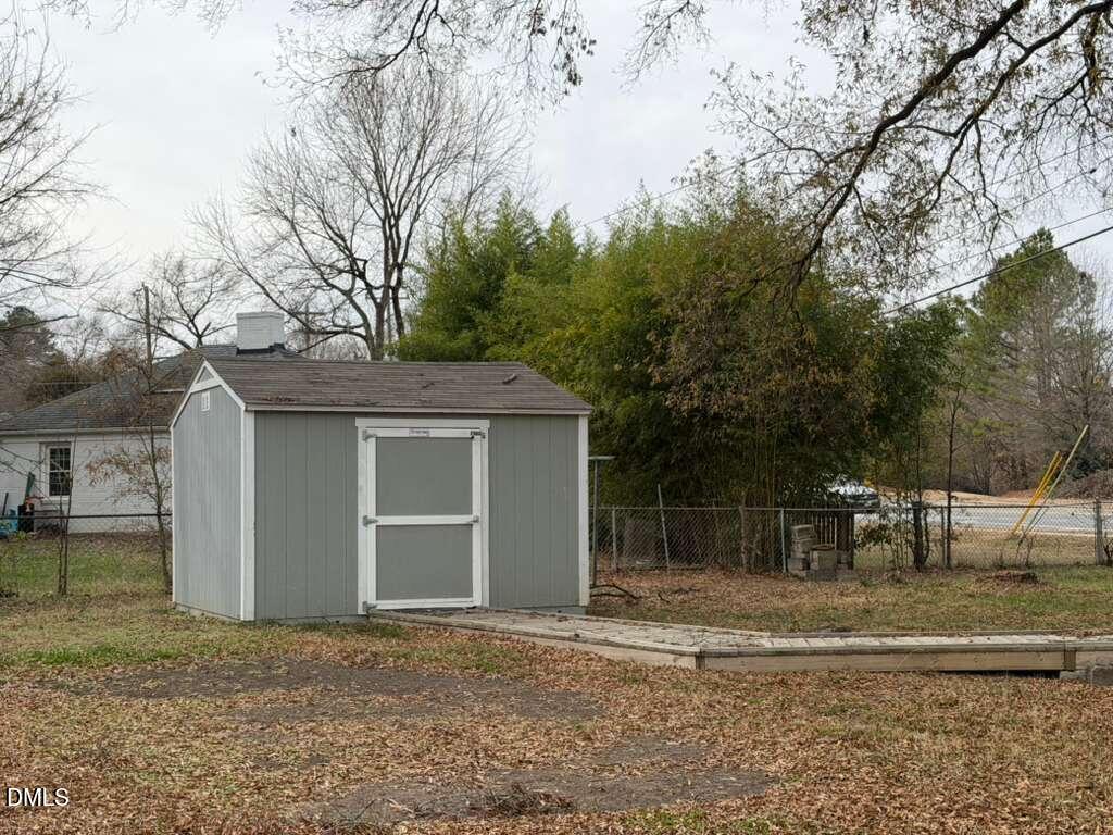 1419 Leon Street Durham, NC 27705 - Photo 7 of 23 a view of a house with a yard and garage