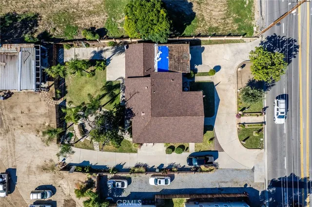 an aerial view of residential houses with outdoor space