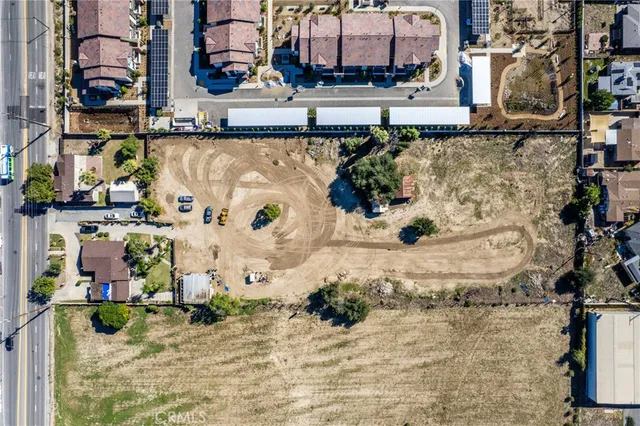 an aerial view of residential houses and outdoor space