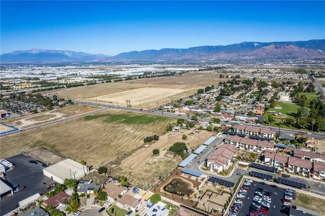 an aerial view of residential houses and outdoor space