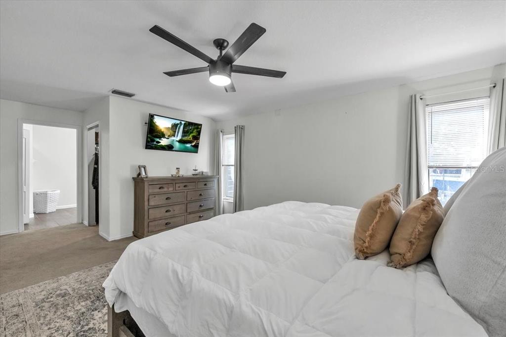 29350 Goodhue Street Punta Gorda, FL 33982 - Photo 12 of 21 a bedroom with a bed a tv and a window