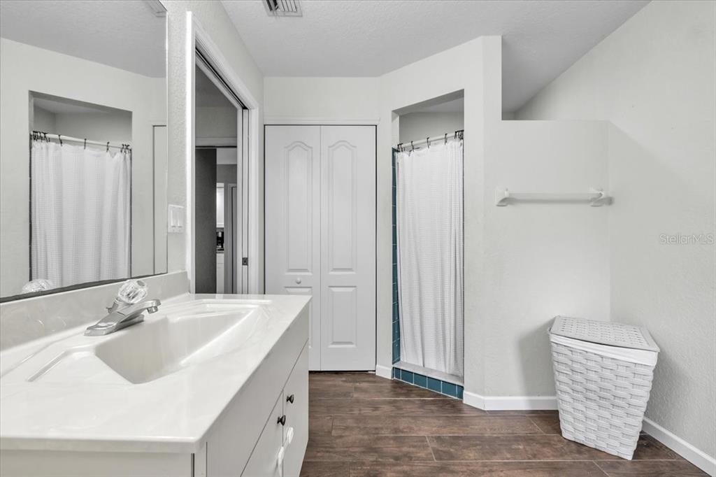 29350 Goodhue Street Punta Gorda, FL 33982 - Photo 13 of 21 a bathroom with a sink and a mirror
