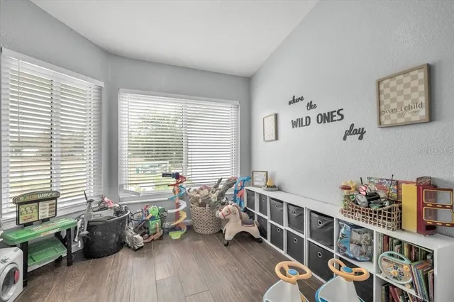 a bedroom with furniture and a window