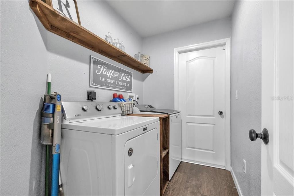 29350 Goodhue Street Punta Gorda, FL 33982 - Photo 18 of 21 a view of a hallway with washer and dryer