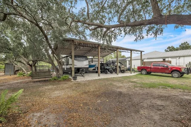 a view of a yard with table and chairs