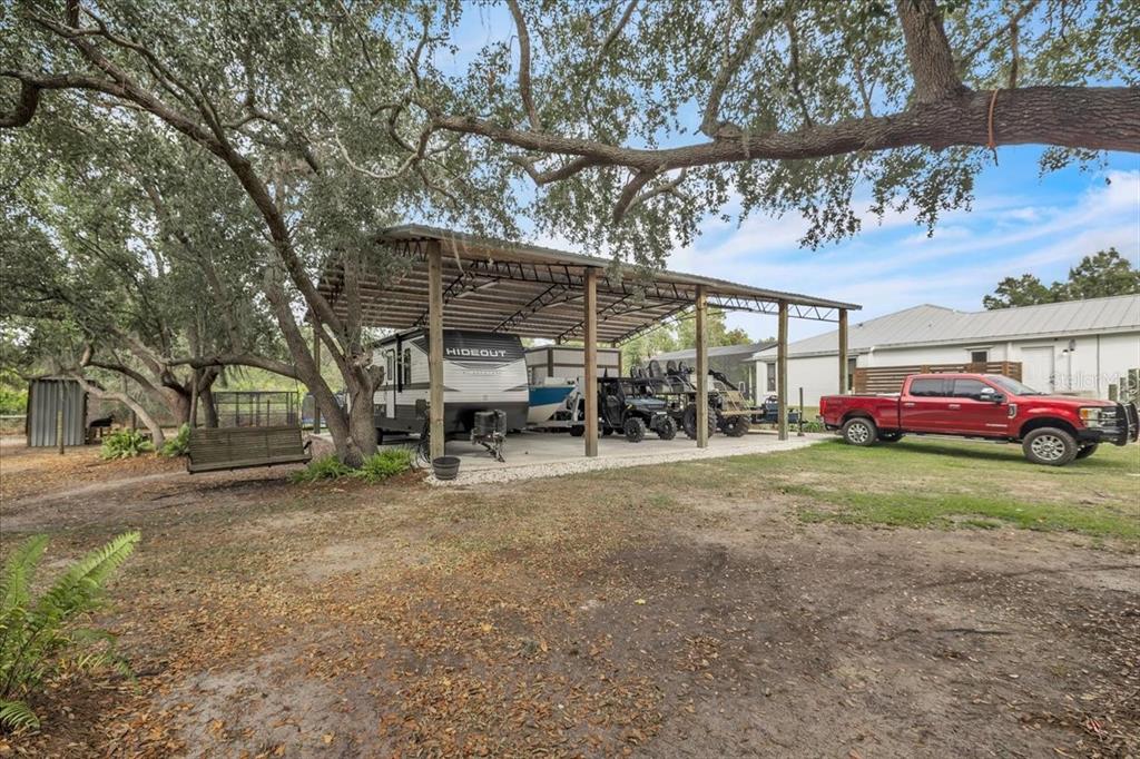 29350 Goodhue Street Punta Gorda, FL 33982 - Photo 20 of 21 a view of a yard with table and chairs