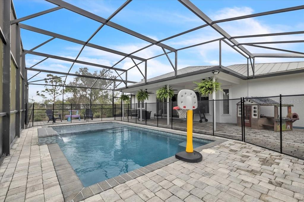 29350 Goodhue Street Punta Gorda, FL 33982 - Photo 3 of 21 a view of a swimming pool with a outdoor seating