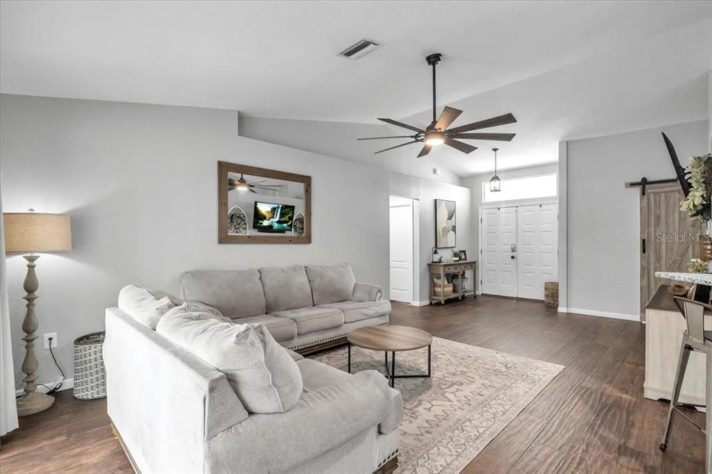 29350 Goodhue Street Punta Gorda, FL 33982 - Photo 9 of 21 a living room with furniture and a ceiling fan