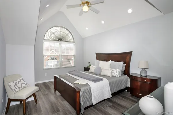 a bed room with a bed and a chair