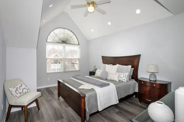 a bed room with a bed and a chair