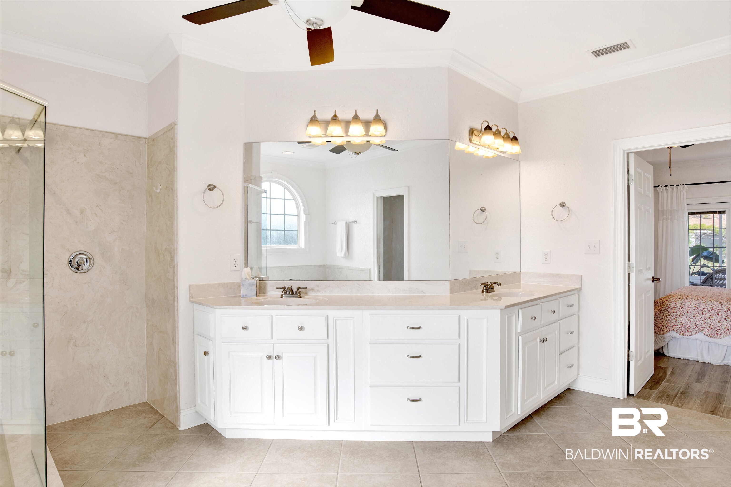 31295 River Road Orange Beach, AL 36561 - Photo 23 of 58 Bathroom featuring tile patterned floors, crown molding, vanity, and a shower