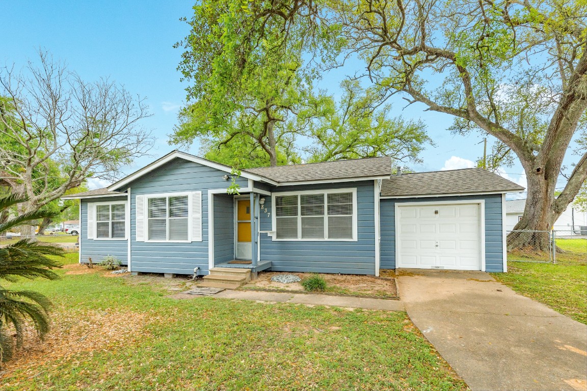 837 Pin Money Street Clute, TX 77531 - Photo 1 of 24 front view of a house with a yard