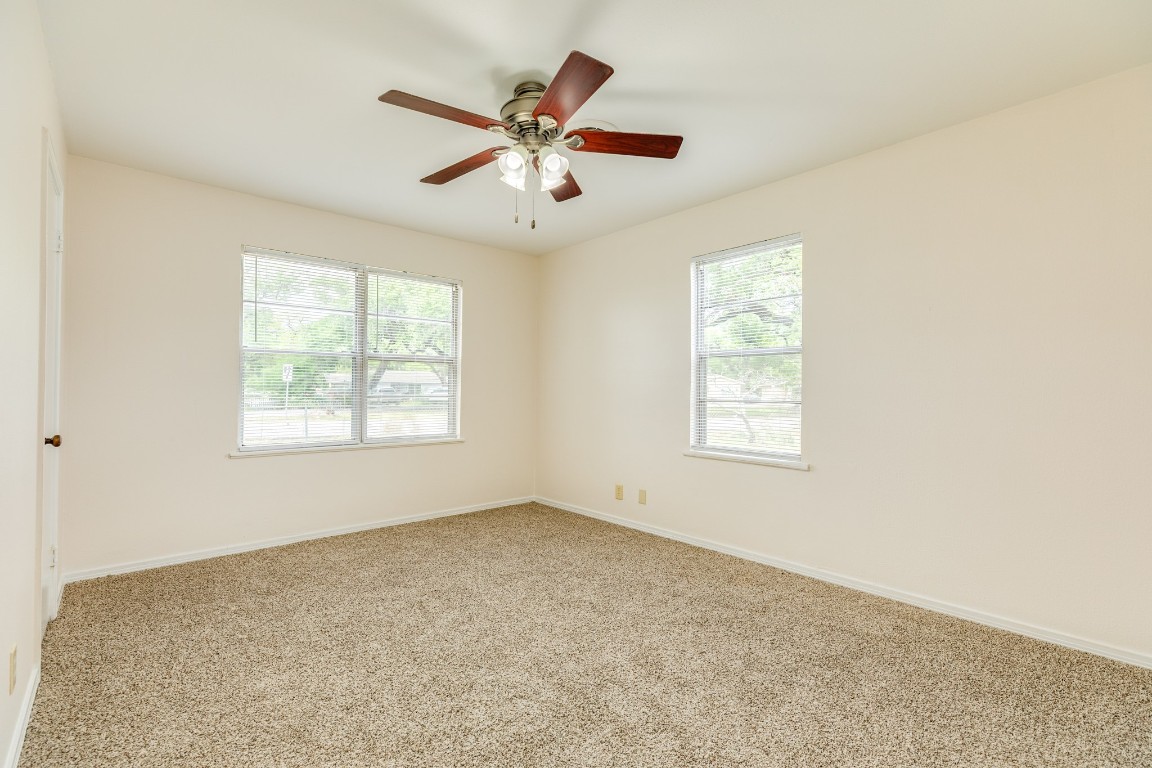 837 Pin Money Street Clute, TX 77531 - Photo 18 of 24 a view of an empty room with a window