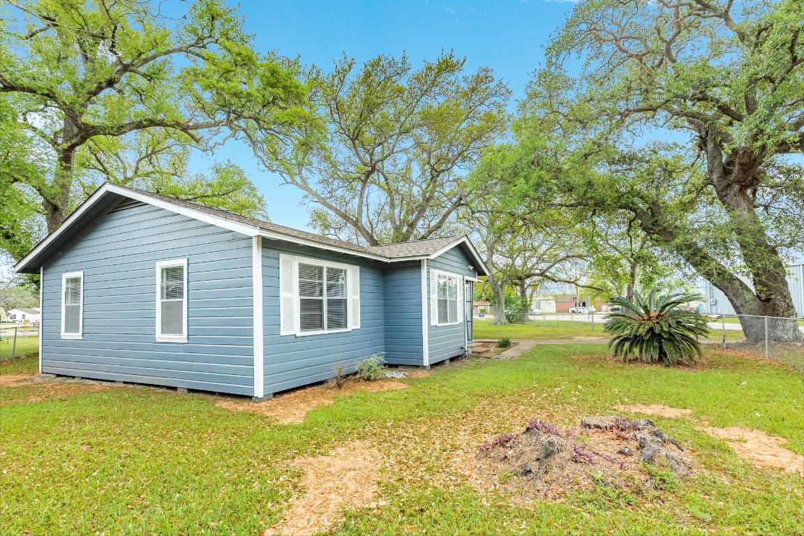 837 Pin Money Street Clute, TX 77531 - Photo 2 of 24 a view of a house with a yard