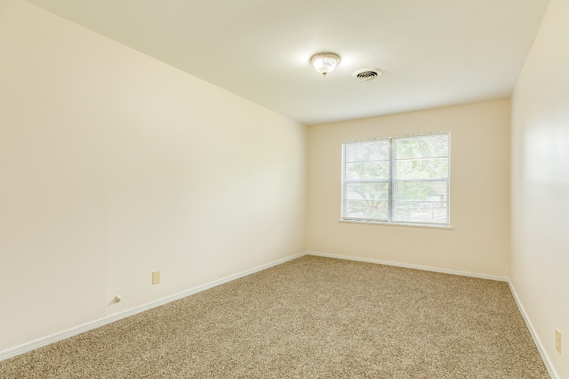 837 Pin Money Street Clute, TX 77531 - Photo 22 of 24 an empty room with a empty space and a window