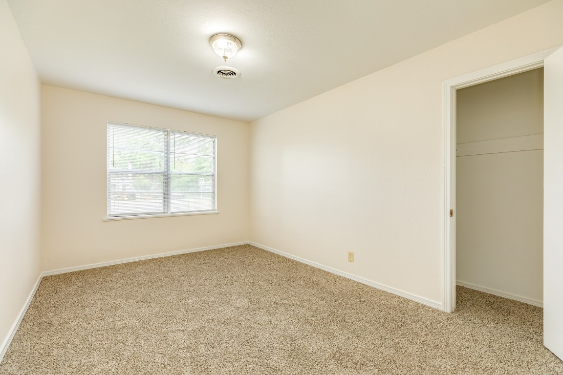 837 Pin Money Street Clute, TX 77531 - Photo 23 of 24 a view of an empty room with a window